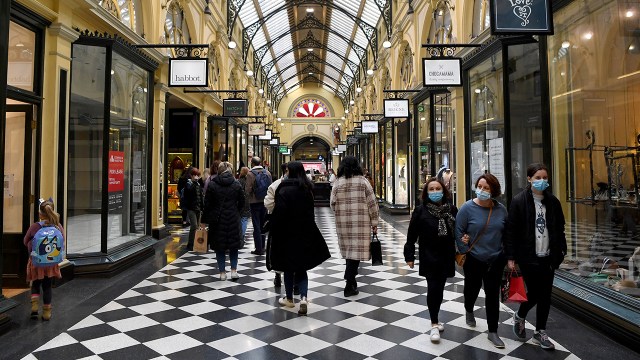 Shoppers return to the central business district in Melbourne, Australia, on July 7, 2021, after the city announced an easing of COVID-19 restrictions. (William West/AFP via Getty Images)