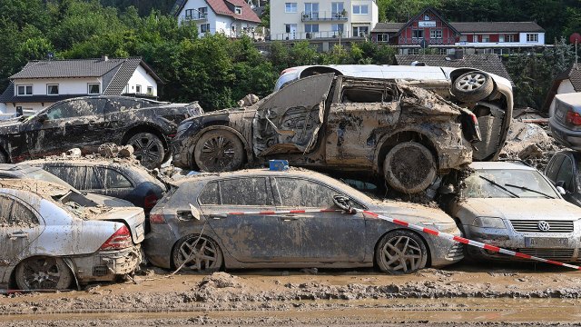 Photo showing mud-covered cars stand piled up near Bad Neuenahr-Ahrweiler in western Germany on July 22, days after deadly floods caused major damage in the region. (Christof Stache/AFP via Getty Images)