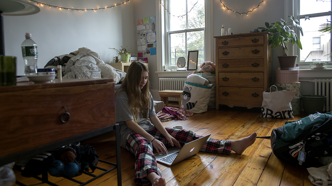 A sophomore at Brooklyn Friends School checks into her classes remotely from home after the school announced that it will be closed due to concerns about the coronavirus in Brooklyn, New York. (Andrew Lichtenstein/Corbis via Getty Images)