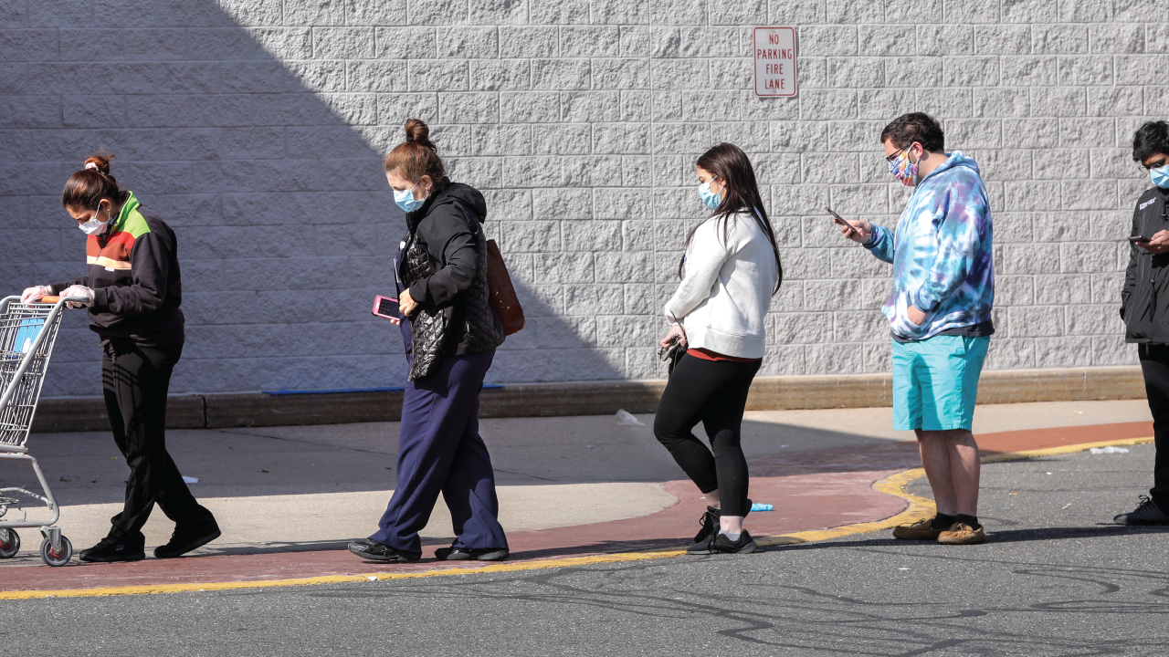Spaced apart and wearing masks, shoppers wait in line to enter Walmart in Centereach, New York, on April 15. (John Paraskevas/Newsday RM via Getty Images).