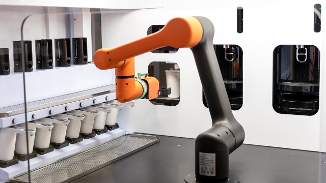 A robot barista that uses artificial intelligence demonstrates its coffee-making process at the 2020 AI Expo Korea in Seoul. (Chris Jung/NurPhoto via Getty Images)
