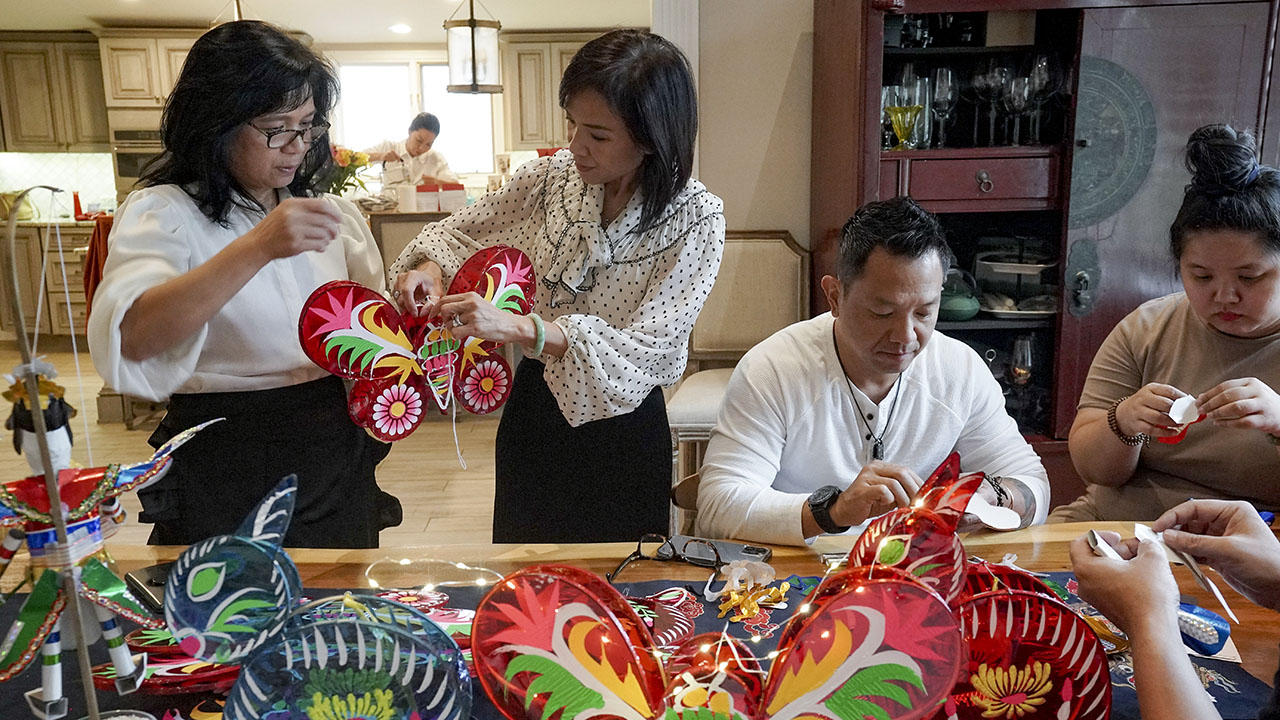 Vietnam Society founder Erin Phuong Steinhauer, center, prepares for Vietnam Week, an annual art and cultural festival, with help from her family and others on Sept. 26, 2023, in Falls Church, Virginia. (Bonnie Jo Mount/The Washington Post via Getty Images)