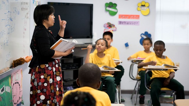 A teacher instructs a fourth grade math class at a private school in Washington, D.C. (Sarah L. Voisin/The Washington Post via Getty Images)
