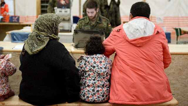 Syrian refugees wait to register at the Erding Air Base in Germany on Jan. 31, 2016.  (Andreas Gebert/dpa/AFP via Getty Images)