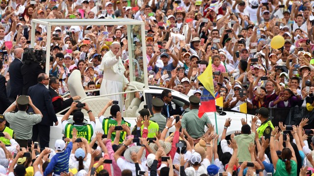 Pope Francis waves to the crowd as he arrives in the popemobile to celebrate an open-air Mass in Villavicencio, Colombia, on Sept. 8, 2017.