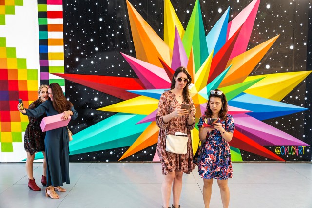 Selfies and social media at a contemporary art show in Miami Beach, Florida, in 2018. (Jeffrey Greenberg/Education Images/Universal Images Group via Getty Images)