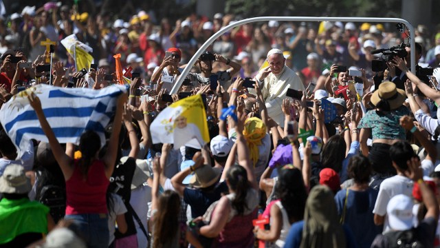 Photo: Pope Francis waves to a crowd from the popemobile as he arrives at the National Shrine of Maipu in Santiago, Chile, in 2018. (Eitan Abramovich/AFP via Getty Images)