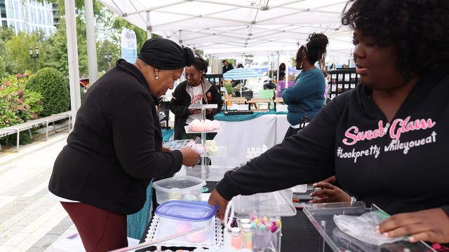 Vendors wait for customers at Black Owned Bos.'s weekend market in Boston's Seaport neighborhood on Sept. 22, 2024. (Jessica Rinaldi/The Boston Globe via Getty Images)