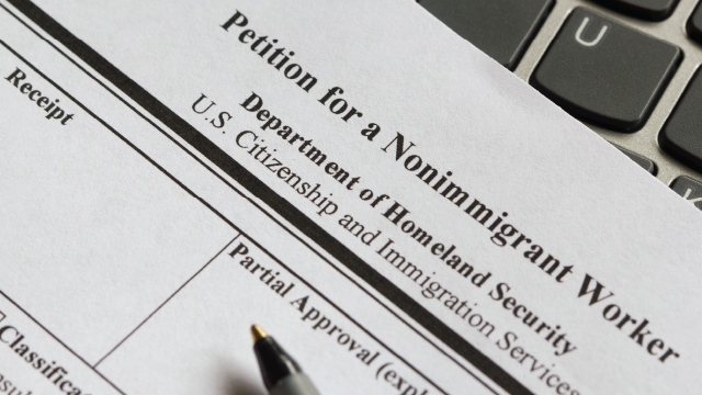 Form I-129 is used by employers to petition U.S. Citizenship and Immigration Services for a beneficiary's H-1B status. (hapabapa via Getty Images)